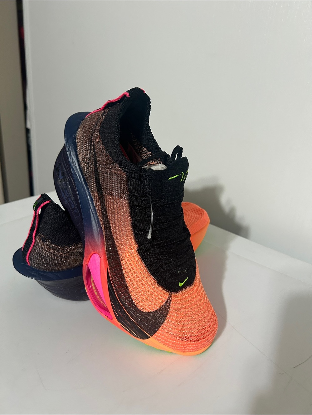 Nike Orange to Black Gradient Flyknit Sneakers with Pink Accents